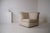 Rare corner lounge chair, probably dating from the late 1970s or the 1980s. Fully upholstered, it is distinguished by its...