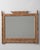 A circa 1900 French wall mirror crafted in carved wood and designed in the faux bamboo style. The frame imitates bamboo...