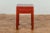 A late Qing Dynasty period red lacquer wooden side table from the early 20th century with single drawer and horse hoof...