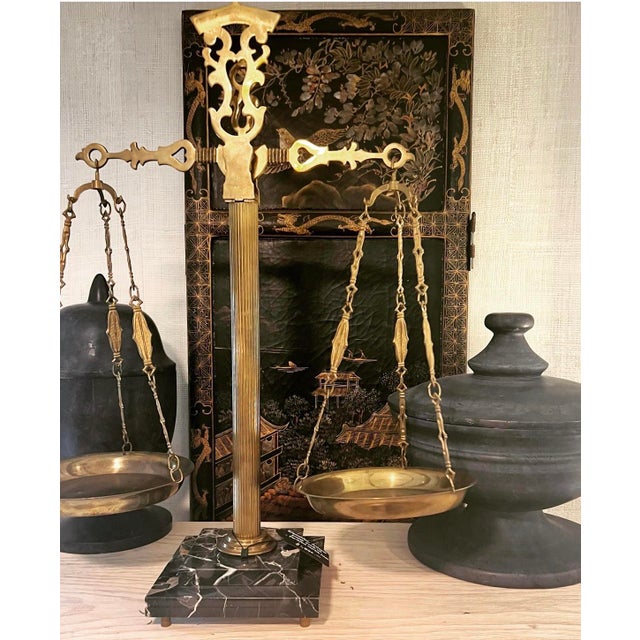 A classic antique scale with a polished Portofino marble base, fluted aged-brass stem and etched fittings, hand-made in...