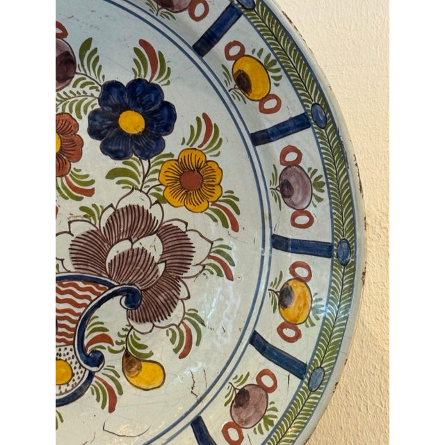 18th Century Delft Polychrome Charger With Floral and Scroll Motif For Sale - Image 4 of 8