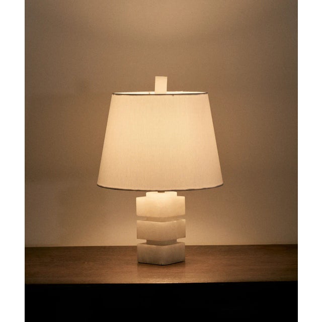 Petite off white marble table lamp. Featuring three (3) stacked marble squares with inset marble circles in between each...