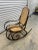Authentic bentwood rocker with hand caned seat and back. Dark stained wood. Made in Poland, indicating Thonet produced
