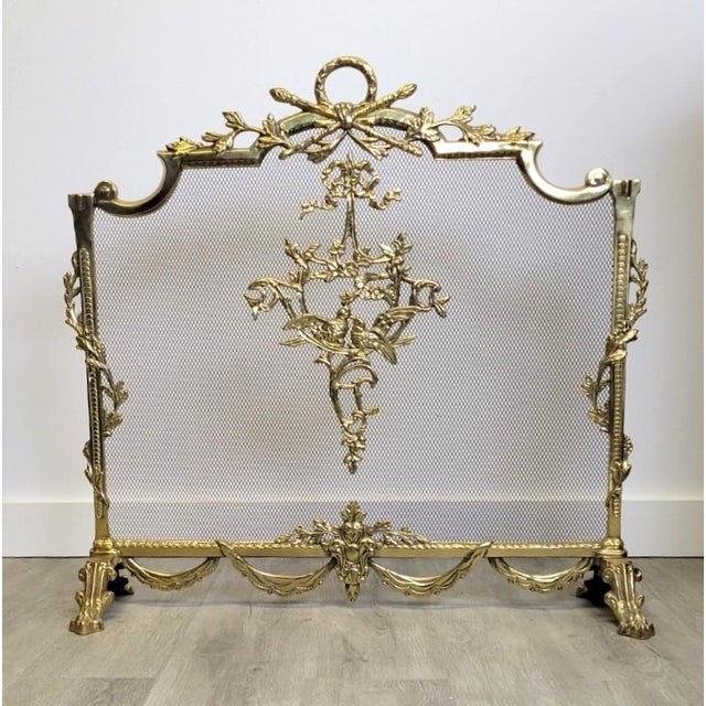 Elevate your hearth with this ornate Louis XV style brass fireplace screen, crafted in Italy during the 1960s–1970s. The...