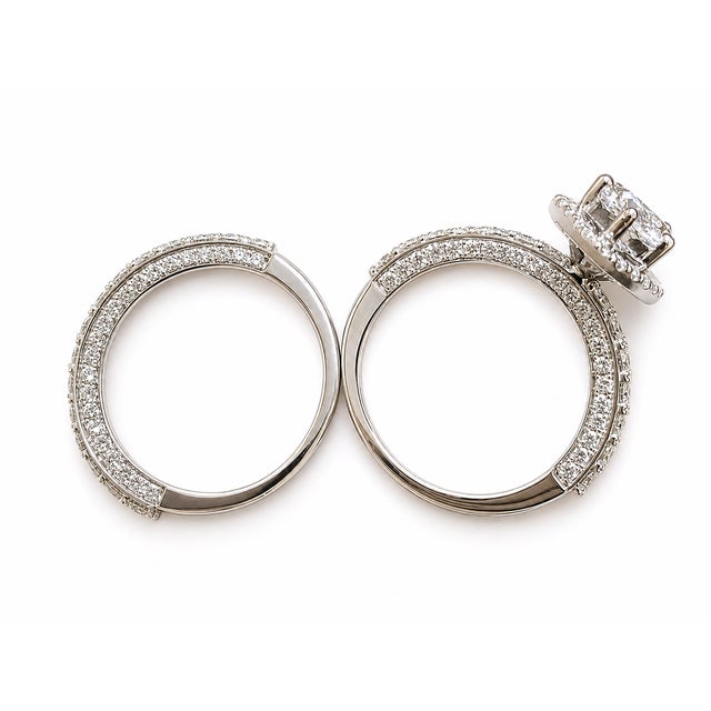 Centered on a marquise-shaped focal point, this 14K White Gold ring combines lab-grown diamonds with a halo and detailed...