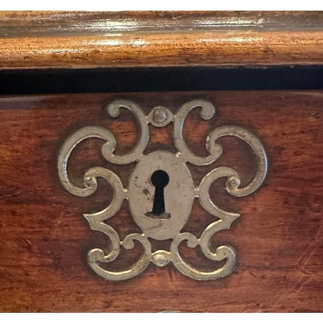 A charming French, walnut side table with one drawer and scalloped apron. Pewter hardware.