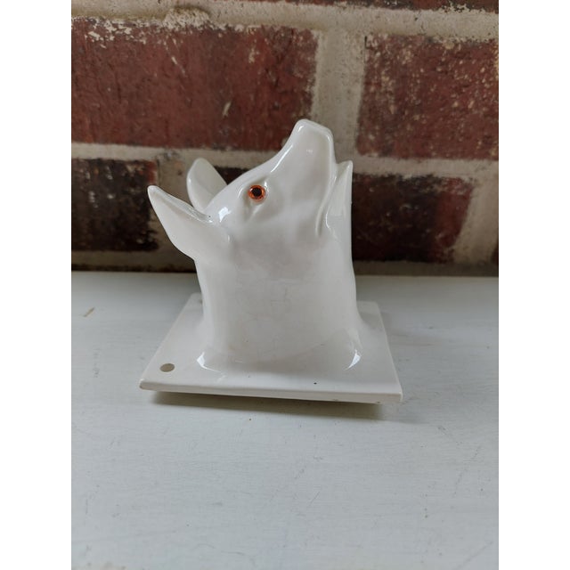 Add a little whimsy to your kitchen with this French style pig head with glass eyes. It has holes for mounting as shown.