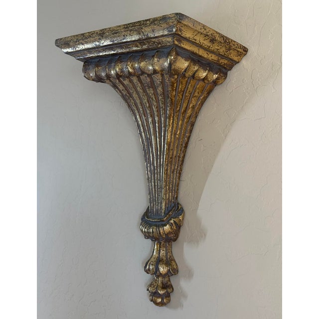 Vintage 20” tall corbel wall shelf with gold leaf finish. Sturdy with a nice weight. Inset screw pockets on reverse. Base...