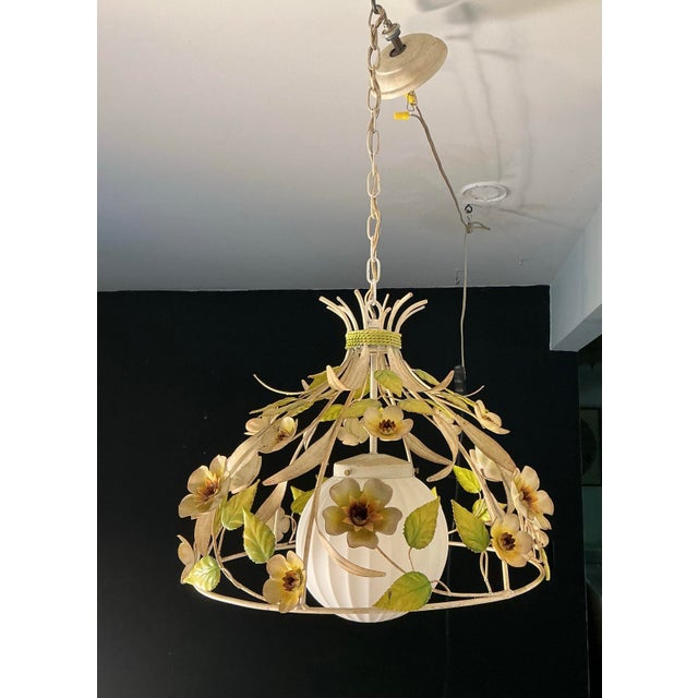 Made in Italy vintage 1960’s Mid Century Modern Italian tole floral chandelier. All original. Features frosted glass globe...