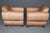 An exceptional pair of French Art Deco style moustache club chairs, professionally restored and reconstructed within the...