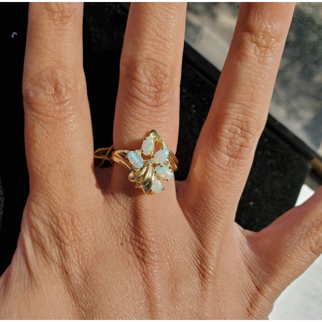 ♥ Product Summary ♥ Main Stone: Australian Opal Approx. Diamond Carat Weight: .04ct Stone Cut: Oval Band Material: 14k...