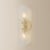 The highly textural Shelley sconce recalls the movement of flowing water. A rippled Piastre glass shade reinterprets a...