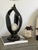 Sleek, abstract lamp from the late 20th century. These pieces were heavily utilized in postmodern and transitional...