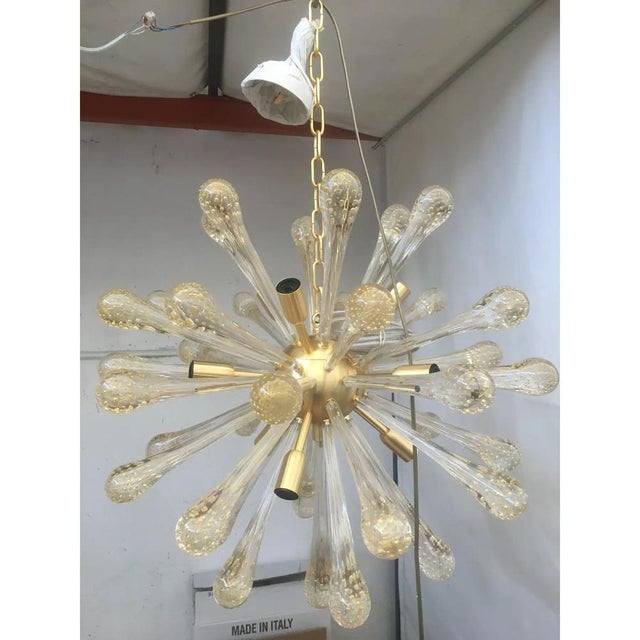 Impressive murano glass sputnik chandelier with gold air drops brushled metal frame all murano glass big drops are in gold...