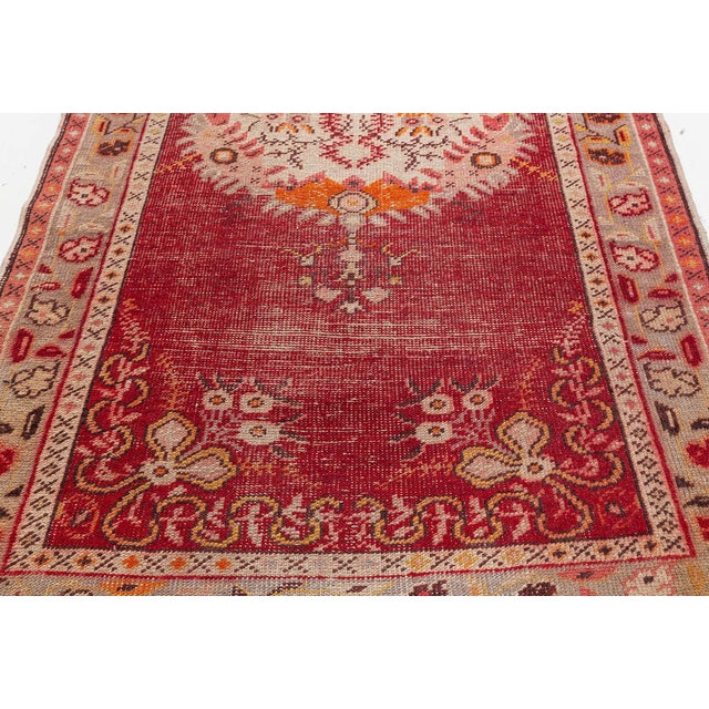 This striking antique Turkish runner from the 1930s is a superb example of Anatolian village weaving, blending traditional...