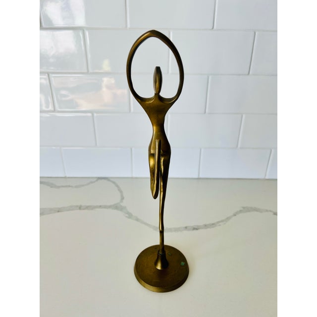 This pair of mid-century modern dancer figurines are made from solid brass. The simple elegance of the design features an...