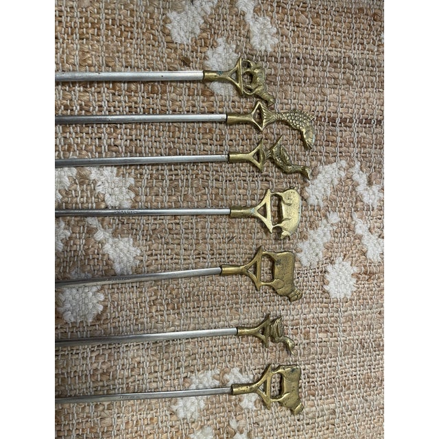 This vintage brass animal top skewers set of 7 is a unique and stylish addition to any backyard barbecue or kitchen. The...