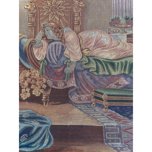 This needlepoint is a handcrafted piece depicting a classical or romanticized Orientalist scene, possibly inspired by...