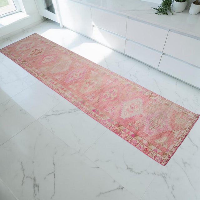 This mid-century Turkish runner rug, originating from the Eastern Anatolian region during the 1960s, is a distinguished...