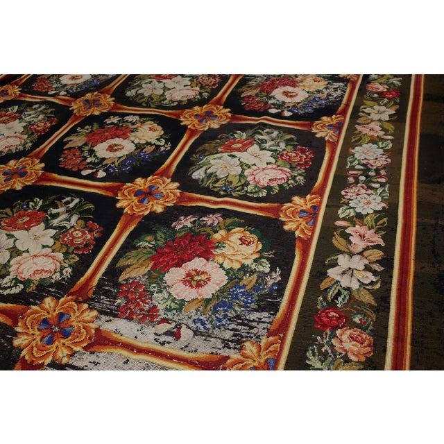 A 13x15 English needlepoint rug from the 1920s joining Rug & Kilim’s Antique & Vintage collection. The rich piece...