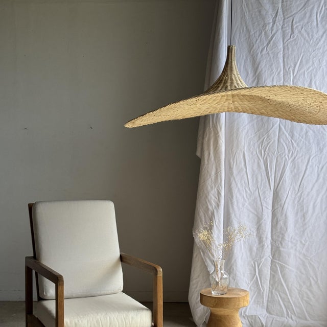 Very large pendant light, lamp, or lampshade in the shape of a woven rattan hat. Height: 50cm; Diameter: 125cm; Weight:...
