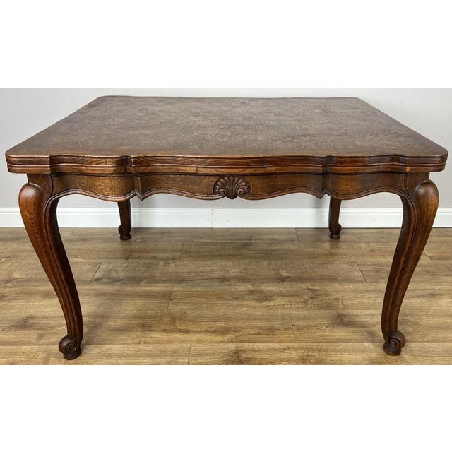 This Vintage French Louis extending dining table is a beautifully crafted piece, combining elegant curves with an eye-...