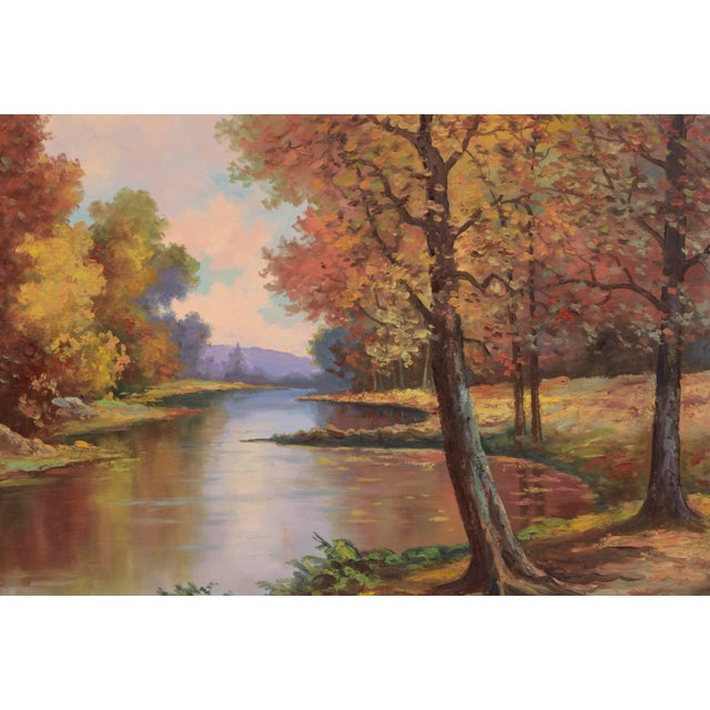 Peaceful landscape of a calm stream winding through an autumnal forest by Lorenz Griffith (American, 1889-1968). Signed...