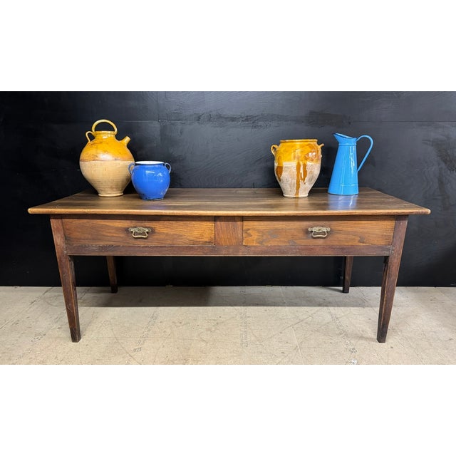 A wonderful late 18th Century French Chestnut Console or Prep Table. Having 2 deep drawers to the front and a bread slide...