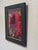 The artwork features a vibrant red rose in the process of blooming, its velvety petals capturing light in a way that...