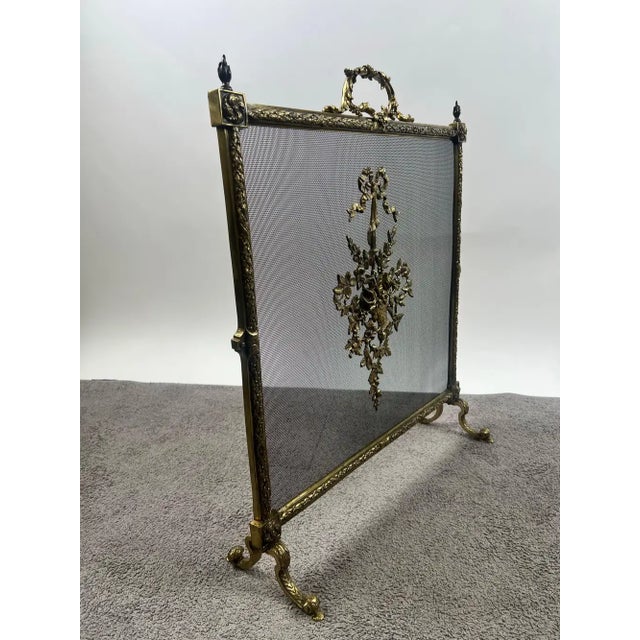 Antique French Art Nouveau Brass Firescreen with Floral & Ribbon Bouquet This exquisite antique fire screen exemplifies...