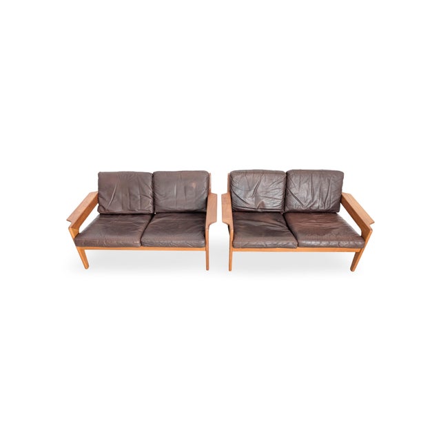 Vintage two-seater sofas from the renowned Danish manufacturer "Komfort". Designed by Arne Wahl Iversen, one of the...