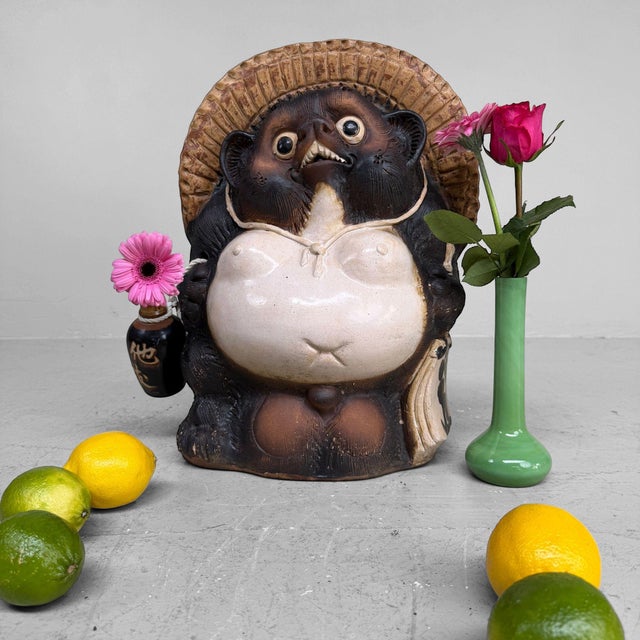 Large Tanuki figure in Shigaraki earthenware, 1970s–1980s, Shōwa period, Japan. This characterful Tanuki figure is made...