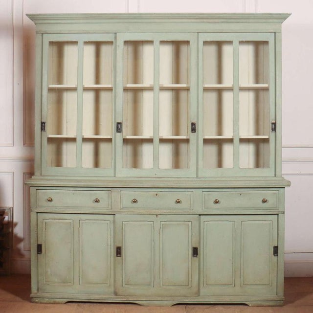 Large 19th century English glazed and painted pine kitchen dresser with sliding doors and great storage. 1880. Top shelves...