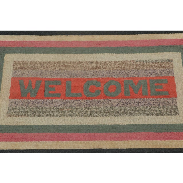 Handmade in wool and fabric circa 1920–1930, this 2x3 antique hooked rug is a charming example from Rug & Kilim’s...