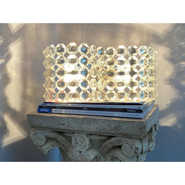 Pair of Ottogonal Crystal Appliques, Italy 1980s. A luminous installation with a design captivating and elegant is the...