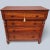 This 19th Century Chest of Drawers is made of solid wood that has acquired a deep patina over time. The facade of this...
