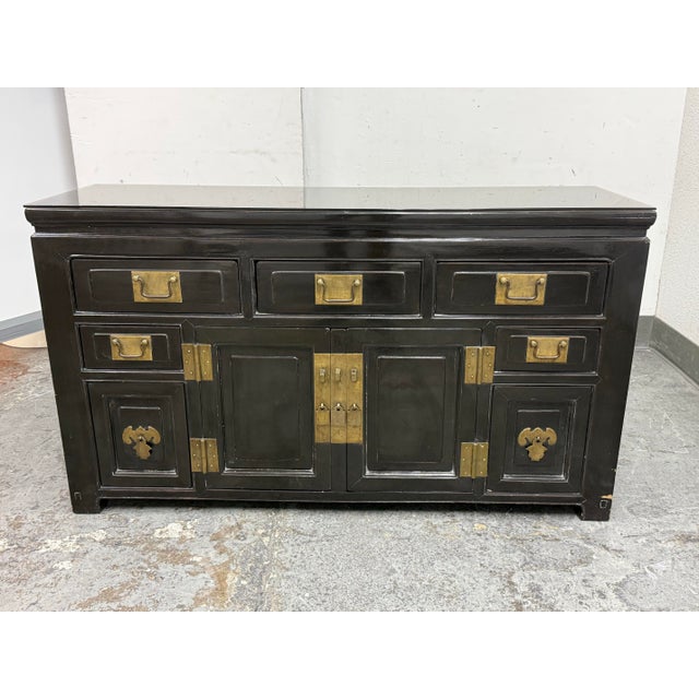 Design Plus Gallery presents a Vintage Tianjin Influenced Black Lacquer Sideboard. This sideboard is made from solid woods...