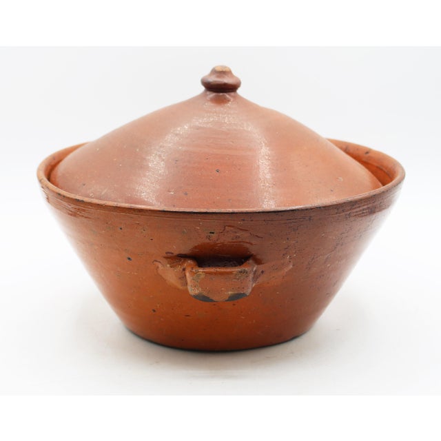 Circa 1930s Ben Owen I large pottery covered bowl. Pumpkin glazed with wonderful signs of use such as burned bottom, etc....
