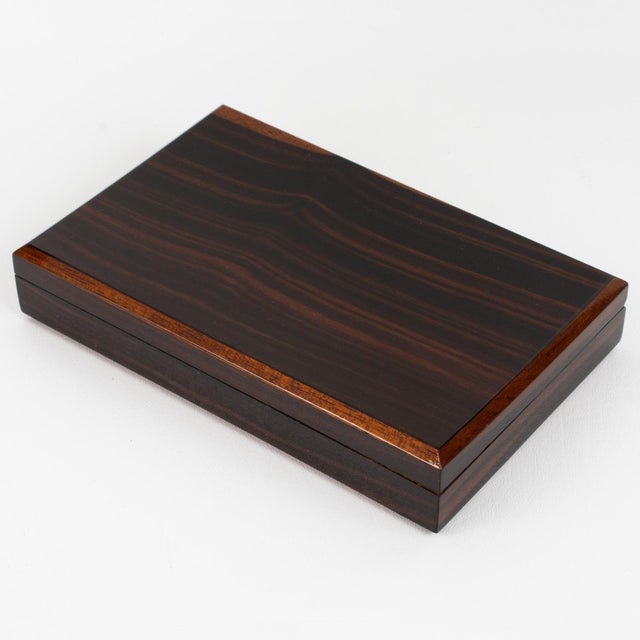 This exquisite Art Deco modernist lidded box boasts a minimalist yet refined and sophisticated shape, featuring varnish...