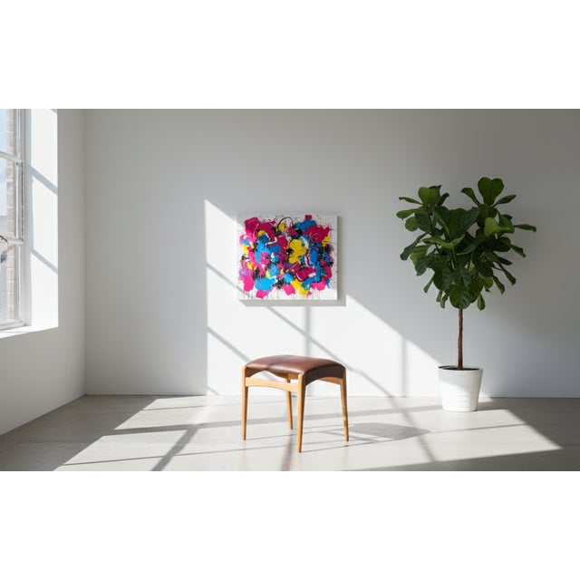 Charming mid-century stool crafted in beech wood with original brown leather upholstery. Produced by a Danish furniture...