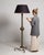 Ebonized floor lamp in Deep Ebony Black. The deep ebony black surface highlights slender turned column, linen drum shade,...