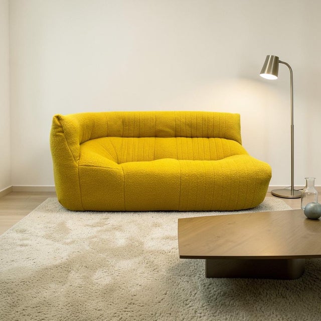 Two-Seater Aralia Sofa in Yellow from Ligne Roset, in Very Good conditions. Designed 1980 to 1989 This piece has an...