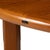 Solid teak expanding dining table in the Danish modern style, made by Sun Cabinet Company in Thailand. Clean lines, warm...