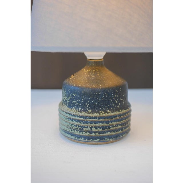 A beautiful handmade ceramic stoneware table lamp base by Rolf Palm, produced in Höganäs, Sweden. This piece embodies the...