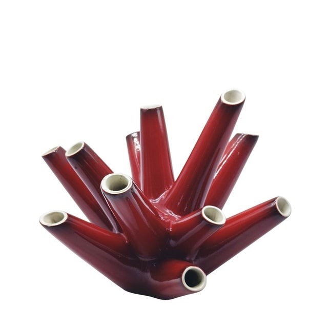 A red glazed ceramic vase in the shape of a coral branch with eleven tendrils. A beautiful Italian design inspired by tree...