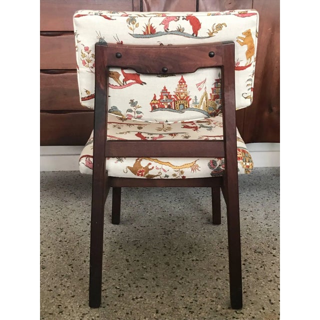 A Classic Jens Risom occasional chair reupholstered in Cowtan and Tout "Fables" linen print. Seat height is 17".
