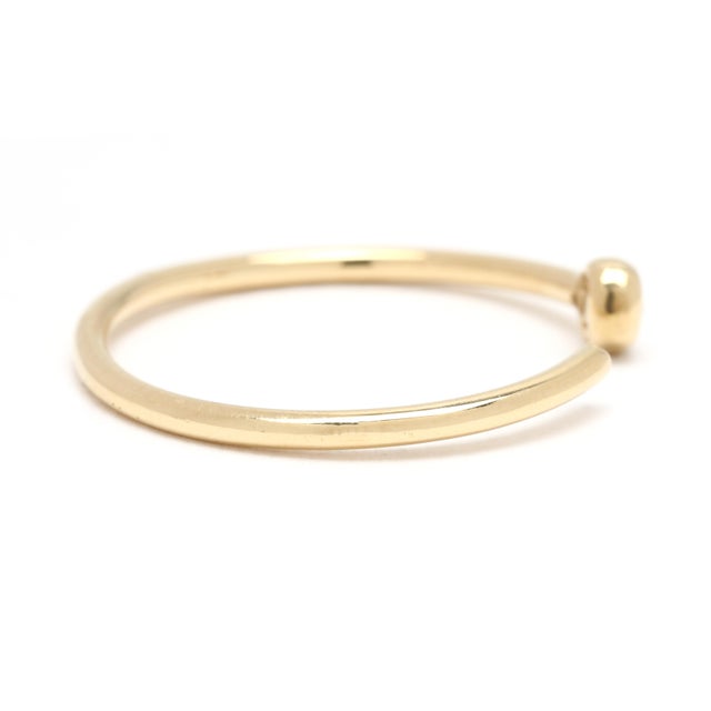 Stones: diamond, 1 stone round brilliant cut 1.75 mm approximately .02 carat Ring Size: 6.5 Rise Off Of Finger: 2.1 mm...