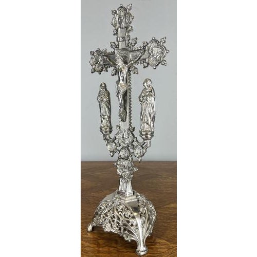 A highly decorative Vintage French crucifix , finely cast in metal with an ornate cross, detailed Christ figure, and...