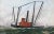 Although unsigned, this technically accurate portrait of a steam trawler with outriggers is probably by George Race...