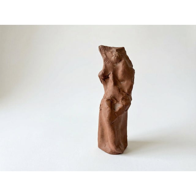 This 1970s clay sculpture by American artist John Tuska captures the abstracted form of a female figure. Hand-formed in...